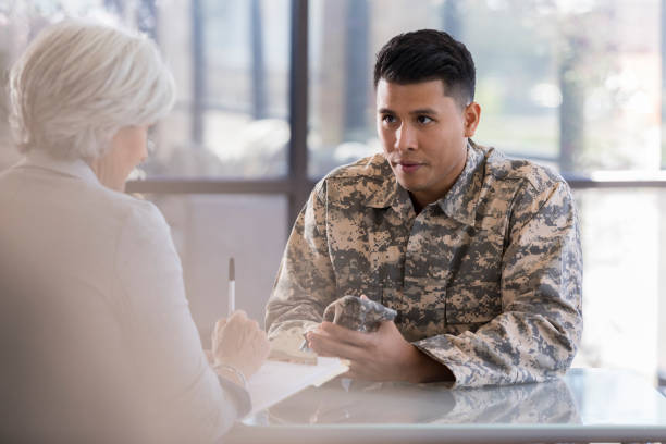 istock Attentive army soldier listens to therapist 1076785850