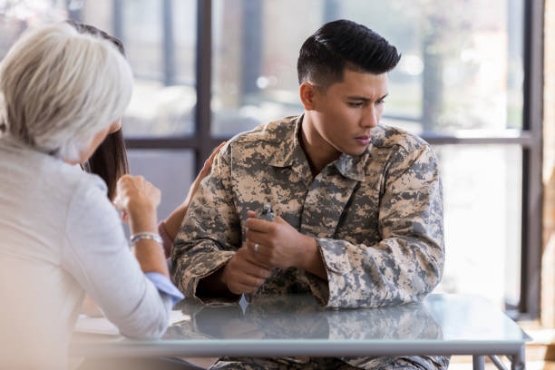 istock Male soldier avoids discussing hard issue during therapy session 1076785856