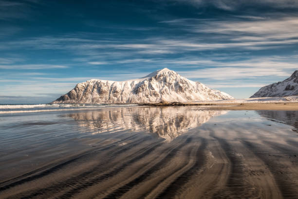 istock Snow mountain with sand furrows on Skagsanden beach 1076788962