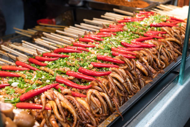istock Grilled squid with mustache spicy and spring onion rows 1076789106