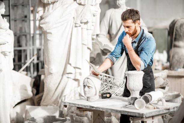 istock Sculptor working with sculptuers in the studio 1076790912
