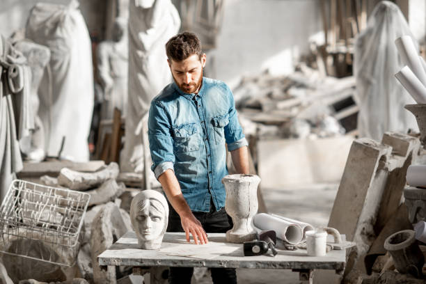 istock Sculptor working with sculptuers in the studio 1076790916