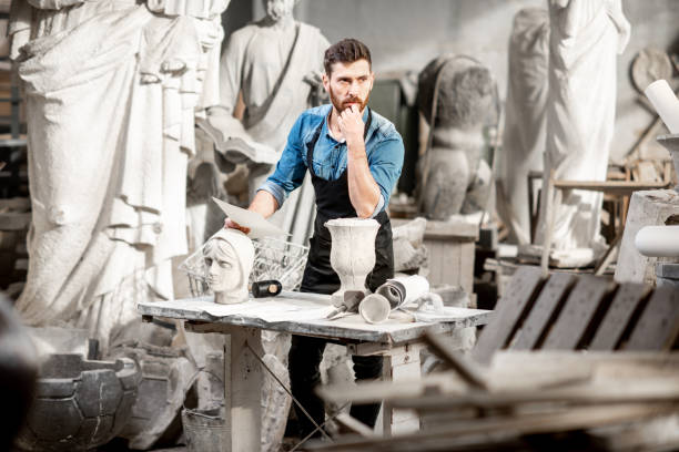 istock Sculptor working with sculptuers in the studio 1076790920