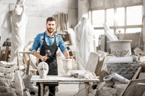 istock Sculptor working with sculptuers in the studio 1076791046
