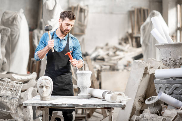 istock Sculptor working with sculptuers in the studio 1076791232