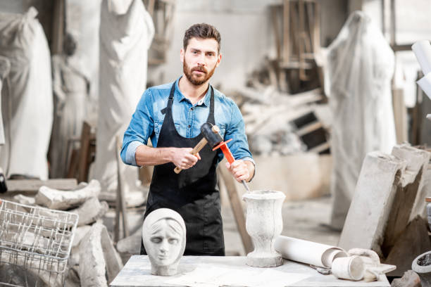 istock Sculptor working with sculptuers in the studio 1076791244