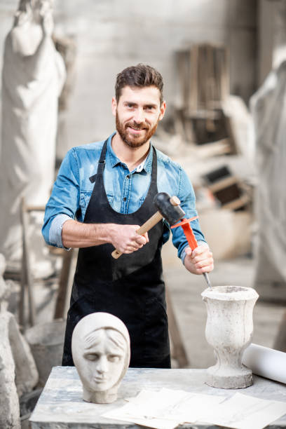 istock Sculptor working with sculptuers in the studio 1076791282
