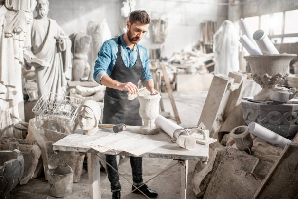 istock Sculptor working with sculptuers in the studio 1076791342