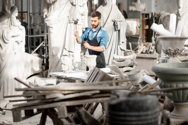 istock Sculptor working with sculptuers in the studio 1076791412