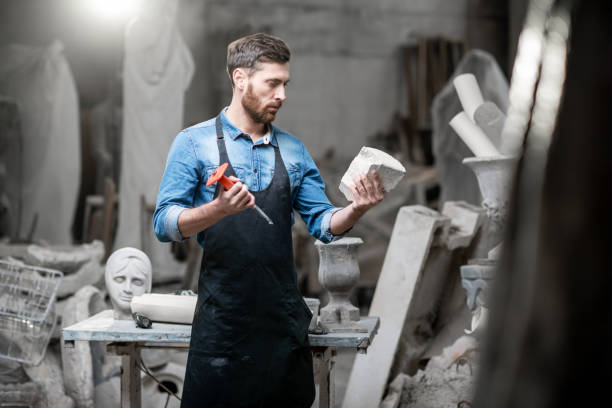 istock Sculptor with vase in the studio 1076794982