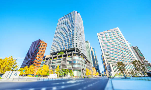 istock looking up view of city skyline, tilt shift effect 1076795398