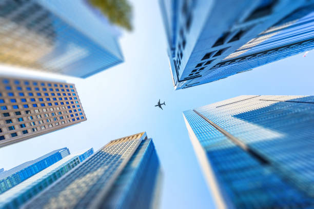 istock looking up view of city skyline, tilt shift effect 1076795760