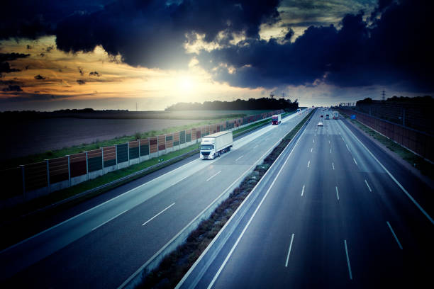 istock Autobahn - view from a bridge at dusk, dramatic sky 1076795808