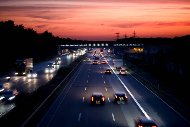 istock German autobahn at dusk, long exposure 1076796110