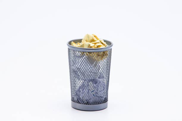 istock Wastepaper Basket With Papers Against White Background 1076797376