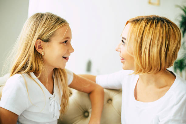 istock Happy mom and daughter at home 1076798594