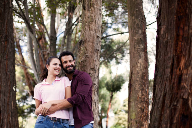 istock Couple embraced in the park 1076799136