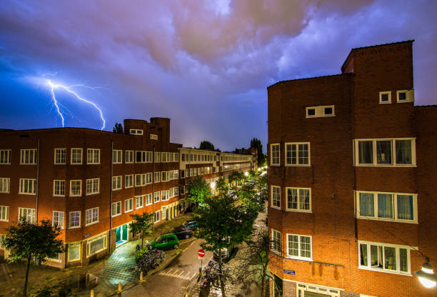 Lightning above houses in Amsterdam stock photo