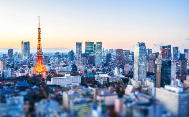 night view of tokyo station with tilt shift Asia Business concept for real estate and corporate construction - panoramic city view and tokyo tower under neon night in tokyo, Japan with tilt shift, miniature, blur effect tokyo japan stock pictures, royalty-free photos & images