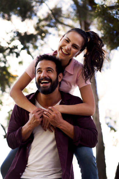 istock Couple playing in the park 1076803064