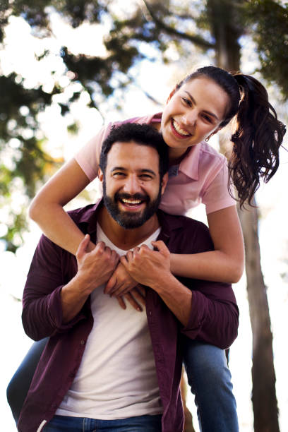 istock Couple playing in the park 1076803456