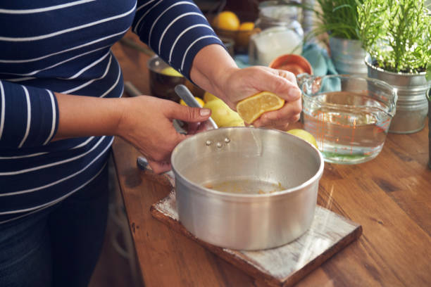 istock Preparing Poached Pears in Vanilla Lemon Syrup glazed with Dark Chocolate 1076809518