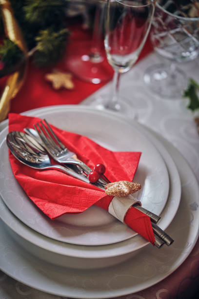 istock Decorated Table for Christmas Dinner with Candles and Christmas Ornaments 1076810612