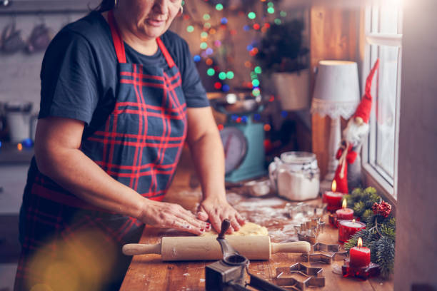 istock Preparing Christmas Cookies in Domestic Kitchen 1076812678