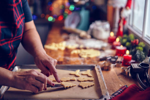 istock Preparing Christmas Cookies in Domestic Kitchen 1076812680