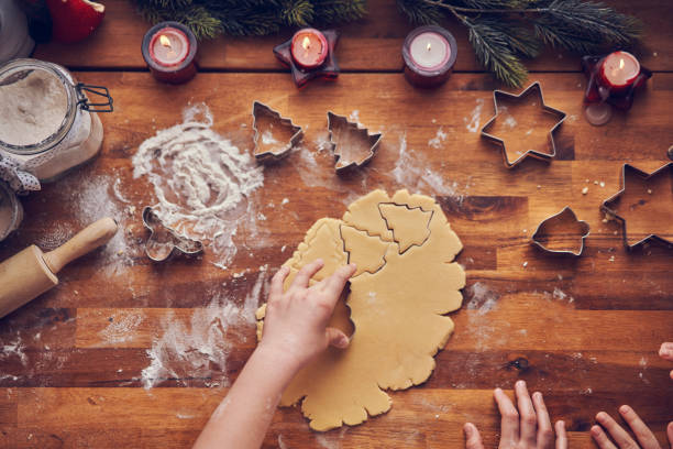 istock Preparing Christmas Cookies in Domestic Kitchen 1076812714
