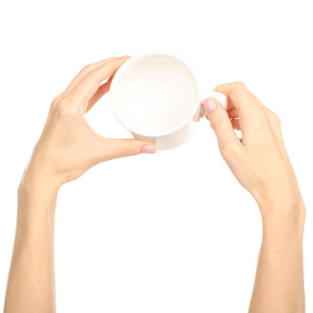 istock White cup mug in hand arm raised up 1076813026