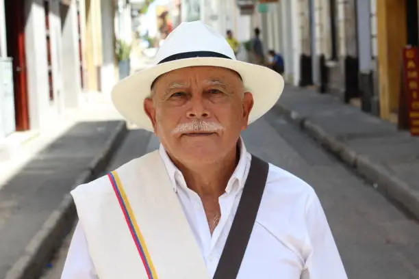 Classy Colombian elder man outdoors.