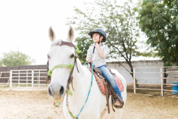 istock Girl Having Fun While Riding Horse During Weekend 1076817758