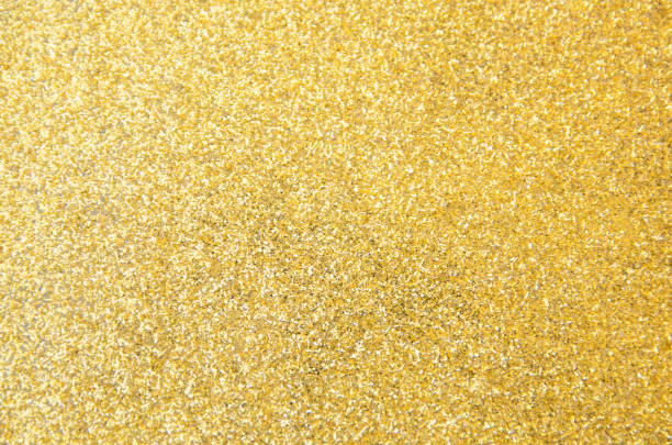 istock Defocused gold glitter background. Gold abstract bokeh background. Christmas abstract background 1076823408