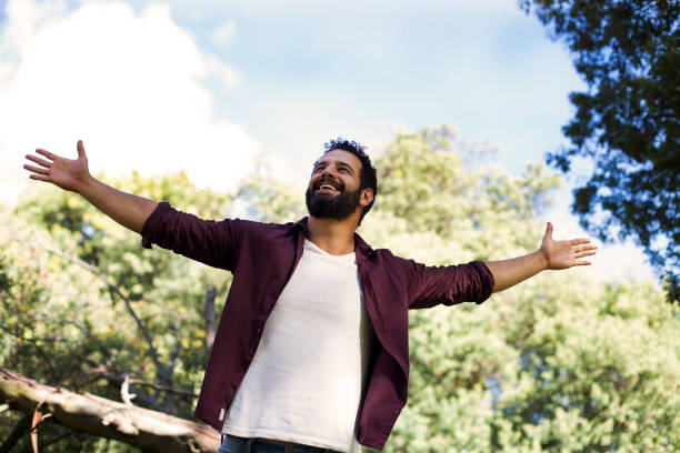 istock Man celebrating in the park 1076823486