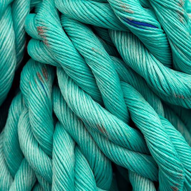 istock Nautical background. Old blue frayed ship rope closeup. 1076823928