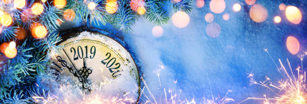istock New Year 2019 - Celebration With Dial Clock On Snow And Lights 1076827426