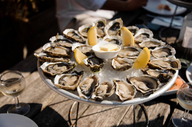 istock Delicious oysters on the plate on the table 1076827506