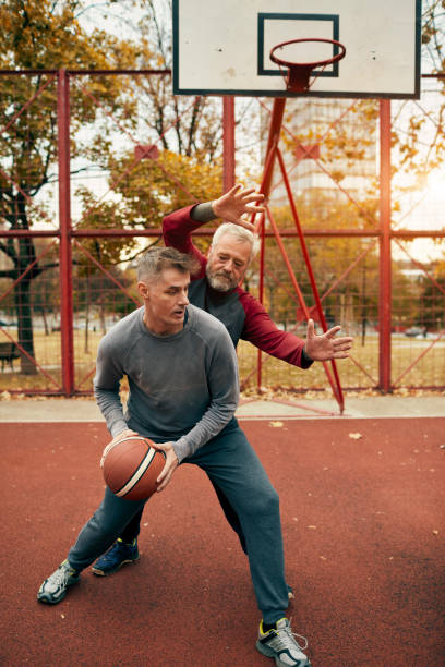 istock Two generation family playing basketball 1076829414