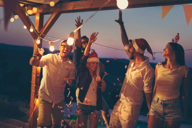 istock Friends having fun at poolside New Year's Eve party 1076829816
