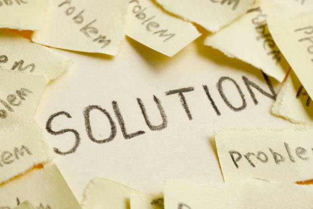 istock The concept of the found solution from a set of unsolved problems. Torn stickers with the word 
