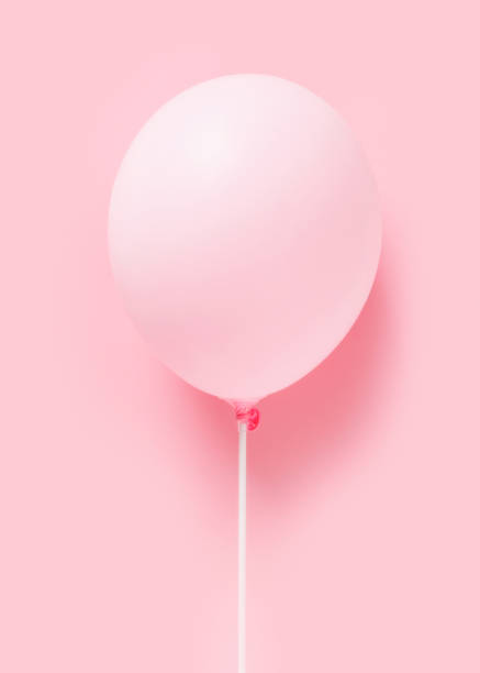 Pink pastel baloon on pink background, lightness, easiness concept, minimalism