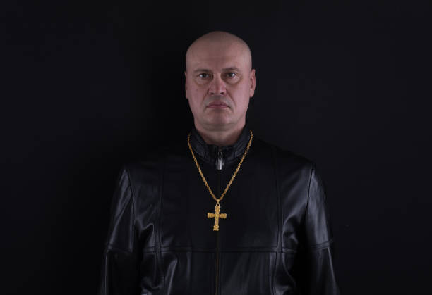 istock studio portrait of a biker on a black background 1076840996