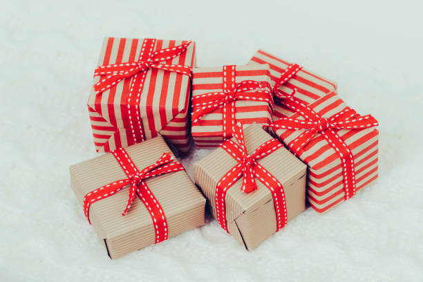 istock Woman's hands hold christmas or new year gift box. 1076842742