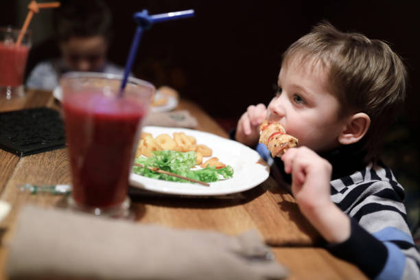 istock Child has kebab on skewer 1076846578
