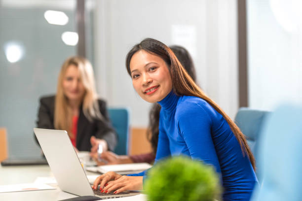 istock Asian woman using laptop at the office 1076848720