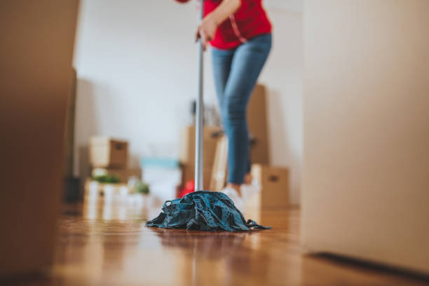 istock Cleaning lady wiping floors at a apartment 1076849508