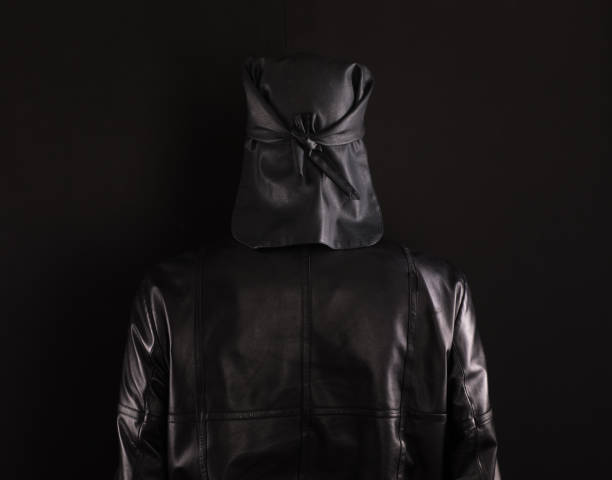 istock hidden mysterious man in the hood 1076850424
