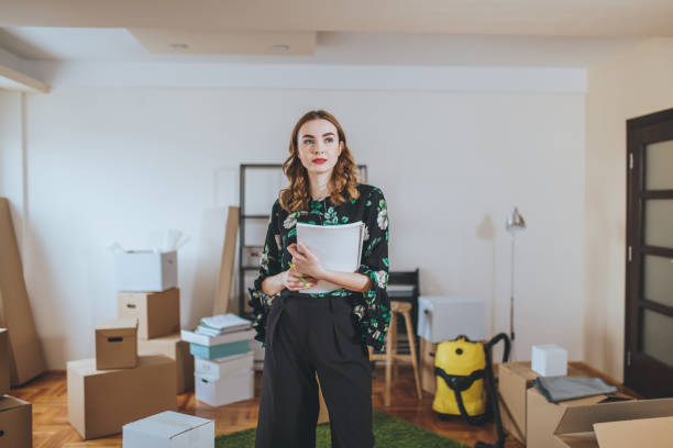 Gorgeous real estate agent in a messy apartment
