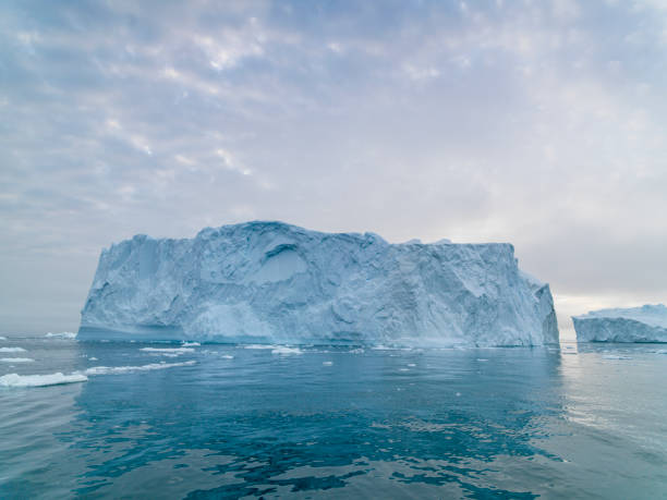 istock Arctic Icebergs on the Arctic Ocean in Greenland 1076853886